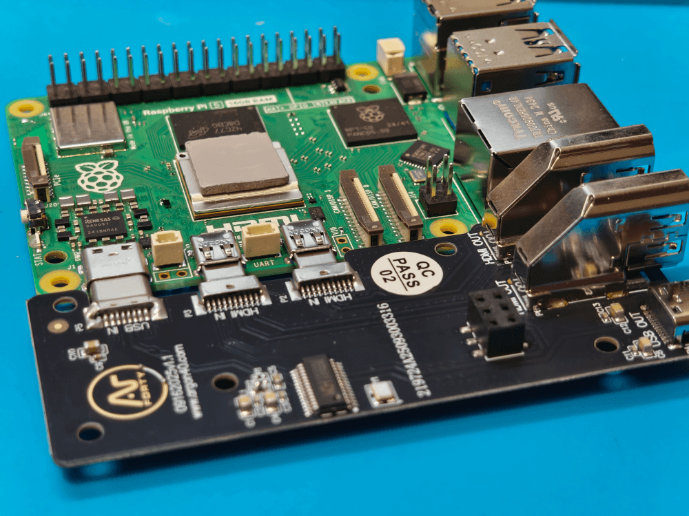 The Raspberry Pi 5 with the extender board connected and the heat sink putty in place.