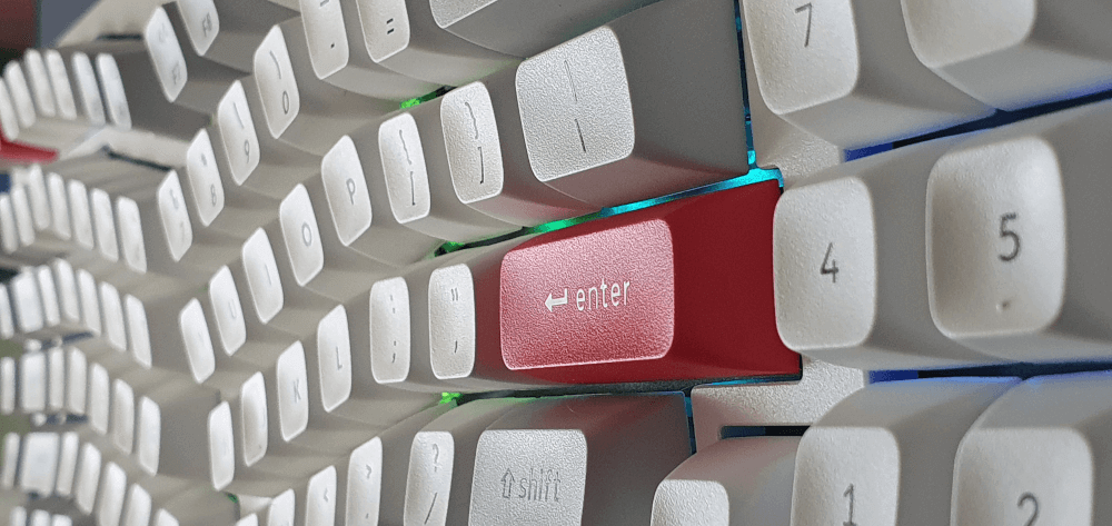 A close up of the red enter key of the Keychron q13 pro. Also showing the lighting.