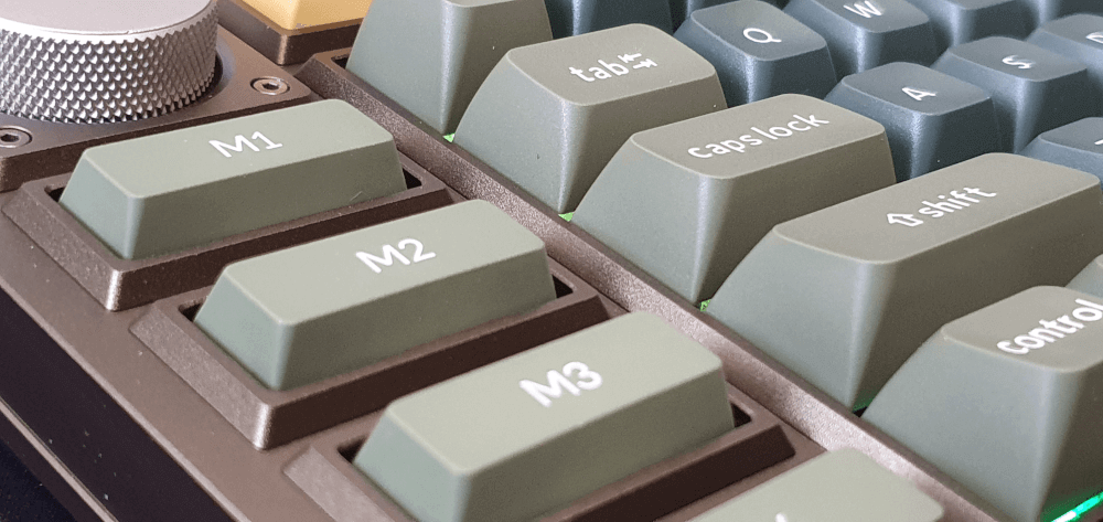A close up of the Keychron Q3 pro, showing the wheel and macro keys on the left hand side of the board.