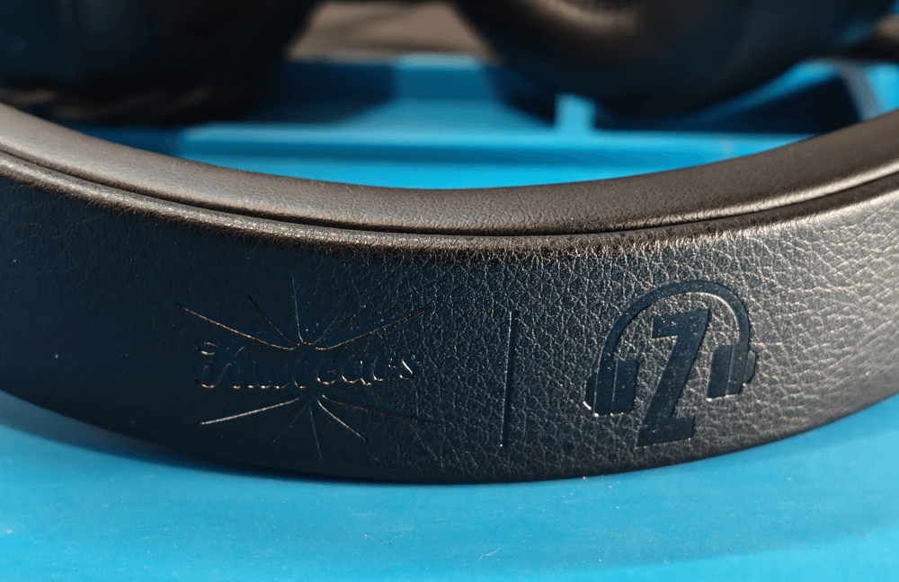 The top of the headband of the Kiwi Ears x Z Reviews Serene headphones. Showing the Kiwi Ears and Z Reviews logos.